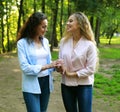 Close up of mother and grandmother smilling in a park Royalty Free Stock Photo