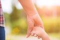 Close up mother holding a child`s hand. Royalty Free Stock Photo