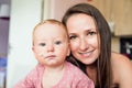 Close up of mother holding her cute baby daughter Royalty Free Stock Photo