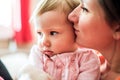 Close up of mother holding her cute baby daughter Royalty Free Stock Photo