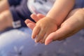 Close up mother`s hand hand her baby. Love family healthcare and medical body part mother`s day concept