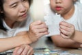 Close up of mother and son lying on the floor holding puzzle pieces and putting them together. Happy family during work at home. Royalty Free Stock Photo