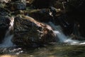 Close-up of Motion-Blurred Water Rapids Flowing over a Stone Royalty Free Stock Photo