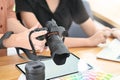 Close-up motivated of photographers checking they camera in they modern workplace Royalty Free Stock Photo