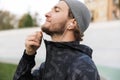 Close up of a motivated young fit sportsman listening to music