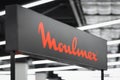 Close-up on the Moulinex logo on a decorative stand in store