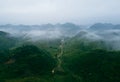 Close up of mountain hills valley with forest and fog cloud