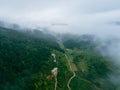 Close up of mountain hills valley with forest and fog cloud