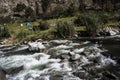 mountain water with stones in the river.mountain river rapids with fast water and large rocky boulders in the water Royalty Free Stock Photo