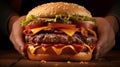 Close up of mouth watering burger being held in hands, poised to be savored with anticipation