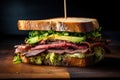 Close-up of a mouth-watering roast beef sandwich with crispy bacon and creamy avocado on toasted sourdough bread Royalty Free Stock Photo