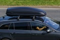 Close-up of a moving car with a roof rack installed. Selective focus Royalty Free Stock Photo