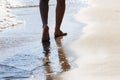 Close up on moving feet of a man walking on the beach in the afternoon at Koh Mak in Trat, Thailand