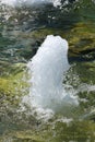 Close up of moving water of a water fountain in a pond