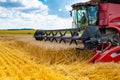 Close-up mower of the combine for harvesting wheat.