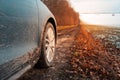 Close-up of muddy wheel of car on road. Offroad driving