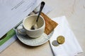 Close-up of a mug next to tip payment on a bar table Royalty Free Stock Photo