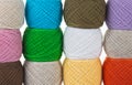 Close-up of multi-colored balls of yarn for knitting. Woolen threads for needlework. Banner format Royalty Free Stock Photo