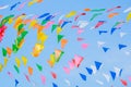 Multi colored party rainbow flags on blue sky for celebration Royalty Free Stock Photo