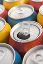 Close Up Of Multi Colored Soda Cans With One Open