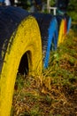 Close-up of multi-colored tires designed for the sports field with a soft background