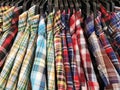 Close up Multicolor Grid pattern Shirts are hanging on Clothes Hanger