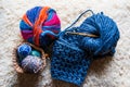 Close-up of multicolored and blue natural wool yarn balls. Royalty Free Stock Photo