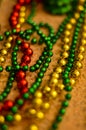 Close-up of multicolored Christmas beads for decorating the Christmas tree with a soft blurred background.