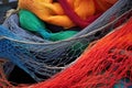 close-up of multicolored fishing nets stacked on a boat deck