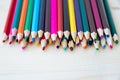 Close up multicolored pencils isolated on wooden background with copy space. Colored wooden crayons Royalty Free Stock Photo