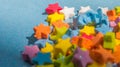 Close-up of multicolored star shapes on blue paper