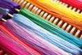 close-up of multicolored threads on a loom