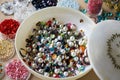 Multicolored vintage pearls and beads in small boxes