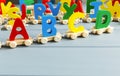 Close up Multicolored wooden letters with ABC on gray background. Set of toys for studying alphabet. Education, back to school Royalty Free Stock Photo