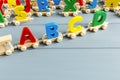 Close up Multicolored wooden letters with ABC on gray background. Set of toys for studying alphabet. Education, back to school Royalty Free Stock Photo