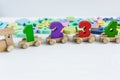 Close up Multicolored wooden numbers on white wooden background. Set of toys for studying mathematics. Education, back to school