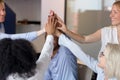 Close up of excited employees join hands showing unity Royalty Free Stock Photo