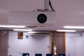 Close up Multimedia projector installed on the ceiling Royalty Free Stock Photo