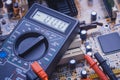 Close-up of multimeter on PCB plate Royalty Free Stock Photo