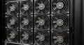 Close-up of multiple black cooling fans in a server rack, essential for data center and computer hardware Royalty Free Stock Photo