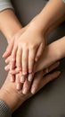 Close up of multiple hands stacked together showing support and unity Royalty Free Stock Photo