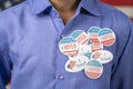 Close up of multiple I Voted stickers on blue shirt - Concept of US election voter fraud by placing multiple voting Royalty Free Stock Photo