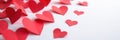Close up, multiple red paper hearts neatly arranged on white , macro, texture