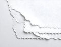 Layered torn white paper sheets with textured edges Royalty Free Stock Photo