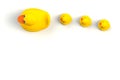 Close up of mum and baby rubber ducks isolated. Bath toys on a white background. Royalty Free Stock Photo