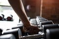 Close up muscular arm. Man hand holding dumbbell Royalty Free Stock Photo