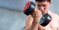 Close up of Muscular bodybuilder guy doing exercises with dumbbells.Young male fitness model lifting weights ,shirtless powerful Royalty Free Stock Photo