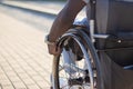 Close-up of muscular male arm rolling wheelchair wheel Royalty Free Stock Photo