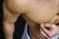 Close up of muscular male torso with nipple