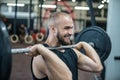 Close up of muscular man at a crossfit gym lifting a barbell Royalty Free Stock Photo